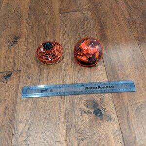 2 electronic spinning toys